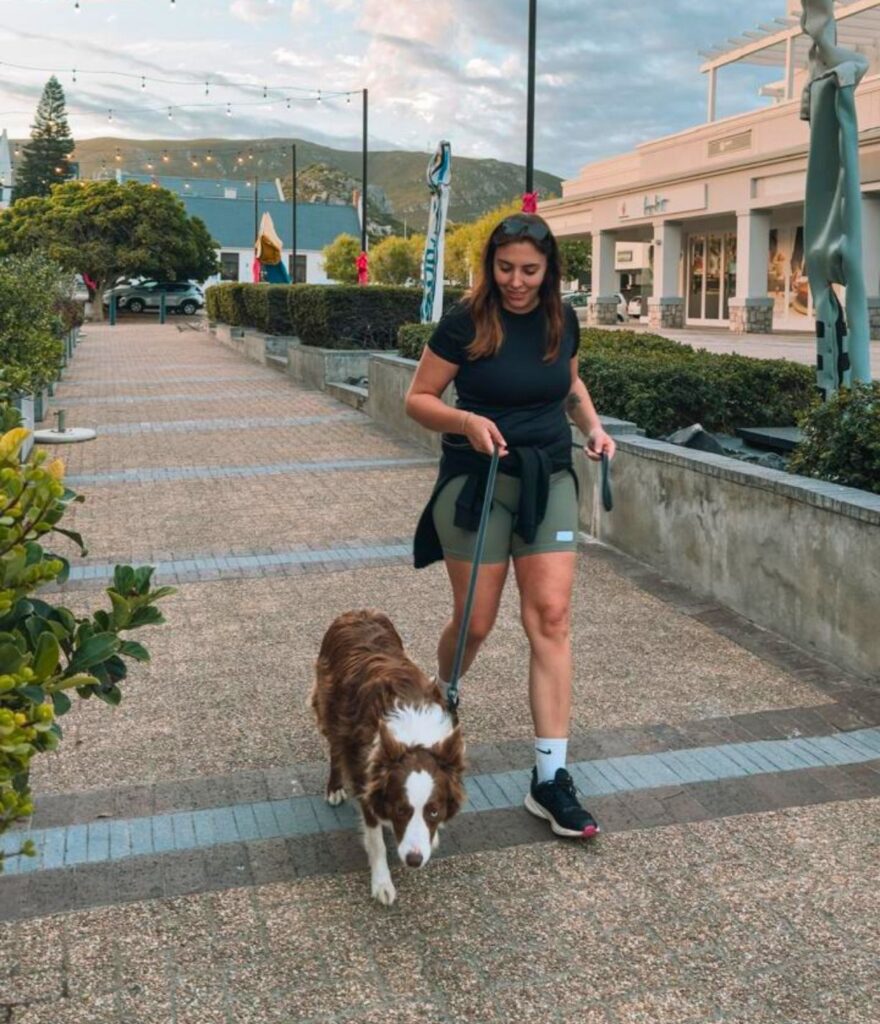 owner of wildbowlco walking her dog